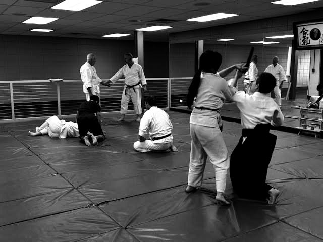 Students practicing on the mat during class